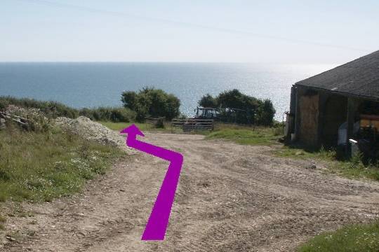 Walk direction photograph: 28 for walk Castle and Beach, Abbotsbury, Dorset, South West England.